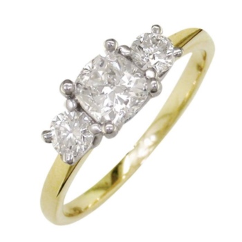18ct yellow gold and platinum 3 stone diamond ring. Centre cushion shaped diamond 0.50ct with 1, 0.12ct round brilliant diamond set either side.