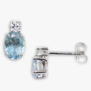 9ct white gold aquamarine and diamond oval stud earrings. Total diamond weight 0.03ct.