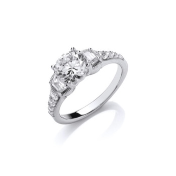 Sparkling solitaire ring with encrusted shoulders.