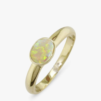 9ct yellow gold rub over set ovel opal ring.
